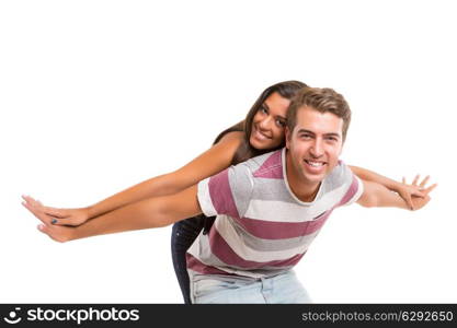 Young couple posing isolated in studio