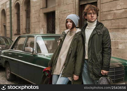 young couple posing outdoors