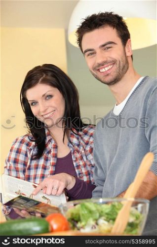 Young couple preparing healthy salad