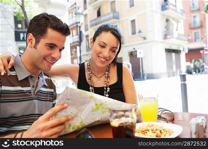 Young Couple Reading City Map
