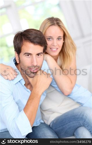 Young couple relaxing in sofa at home