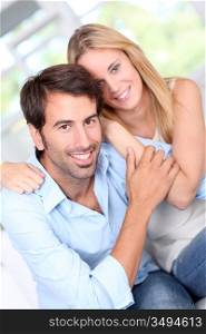 Young couple relaxing in sofa at home