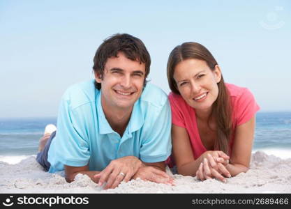 Young Couple Relaxing On Beach