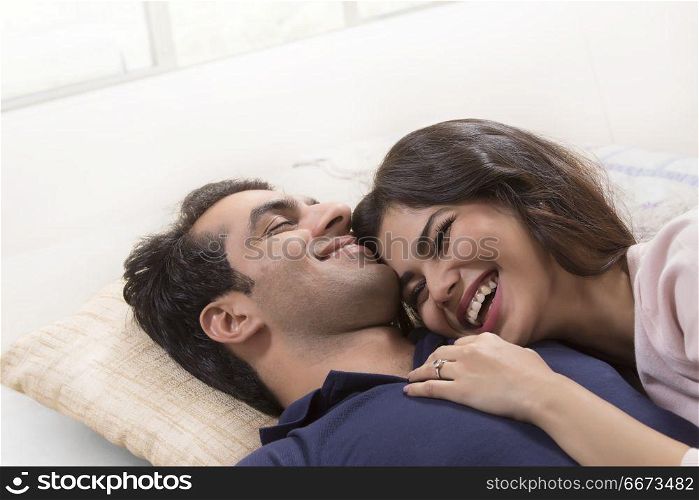 Young couple relaxing on bed