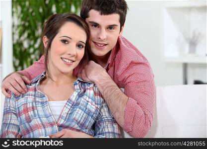 Young couple relaxing on couch