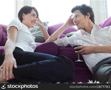 Young couple relaxing on sofa
