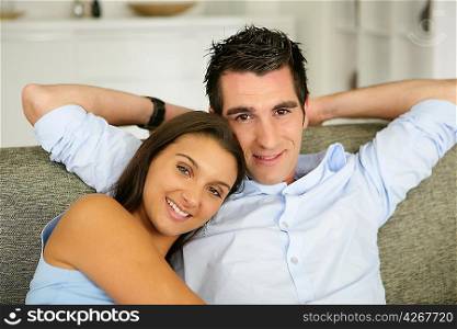 Young couple relaxing on the sofa