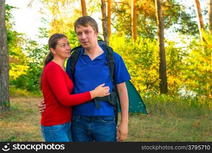 young couple resting family camping