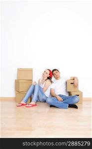 Young couple resting from moving into a new home