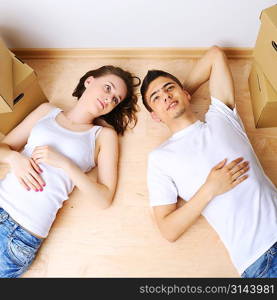 Young couple resting from moving into a new home