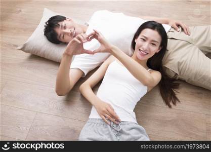 Young couple resting on the floor