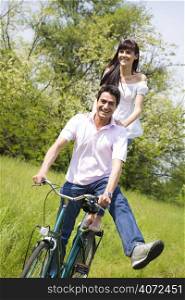 Young couple riding a bike