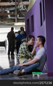 Young couple romancing in a corridor