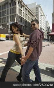 Young couple salsa dancing on the road