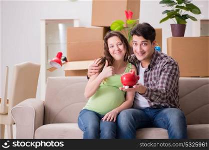Young couple saving money for baby to be born