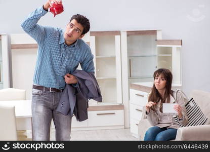 Young couple saving money for new furniture