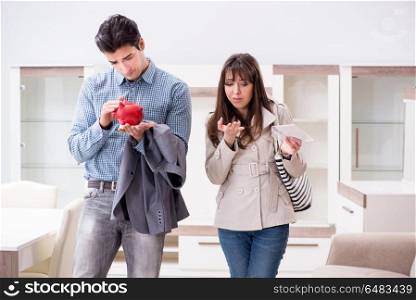 Young couple saving money for new furniture