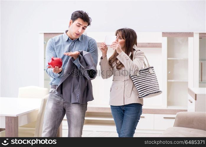 Young couple saving money for new furniture