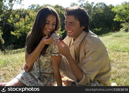 Young couple sharing fresh fruit