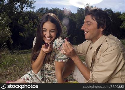 Young couple sharing fresh fruit