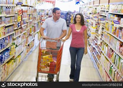 Young couple shopping at a grocery store
