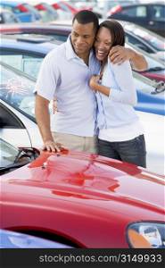 Young couple shopping for a new car