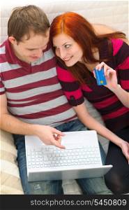 Young couple shopping on Internet