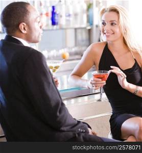Young couple sitting at a bar counter