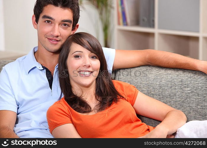 Young couple sitting on a sofa