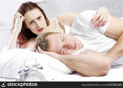 Young couple sleeping peacefully in the bed. Sprouts in bed