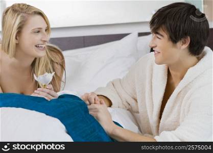 Young couple smiling at each other