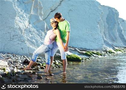 Young couple spending a nice sunny morning on the beach