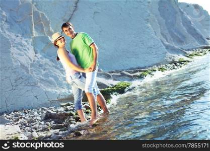 Young couple spending a nice sunny morning on the beach