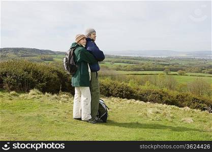 Young Couple Standing in a Field