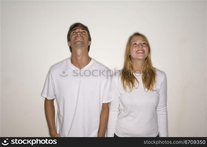 Young couple standing together and smiling