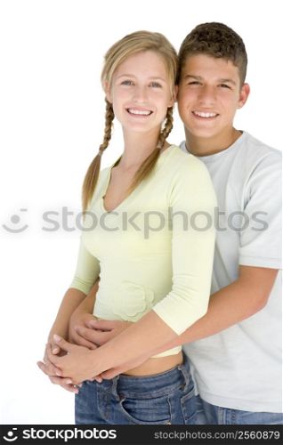 Young couple standing together smiling