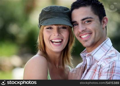 Young couple stood in the park