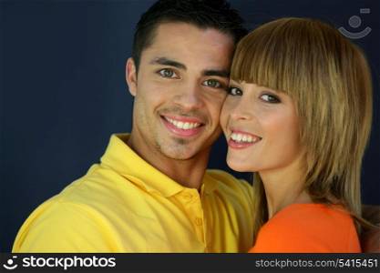 Young couple stood with faces touching
