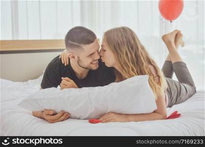 Young Couple sweet love in bed room morning soft focus