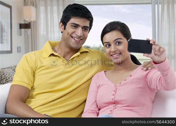 Young couple taking self photograph