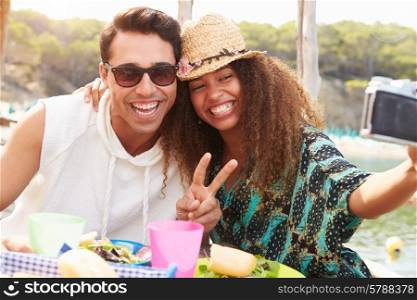 Young Couple Taking Selfie During Lunch Outdoors