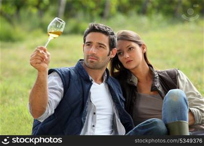 young couple tasting their wine production