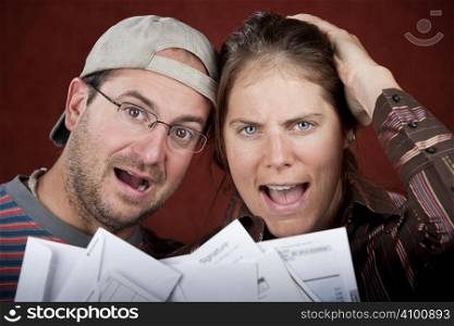 Young couple upset over too many bills