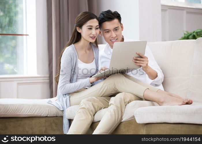 Young couple using a laptop computer