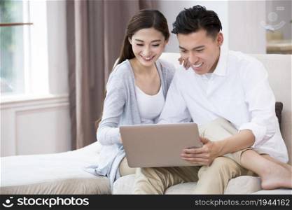 Young couple using a laptop computer