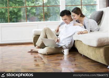 Young couple using a laptop computer