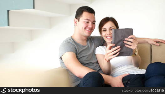 Young Couple using interent on digital tablet