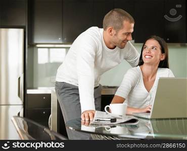 Young Couple Using Laptop