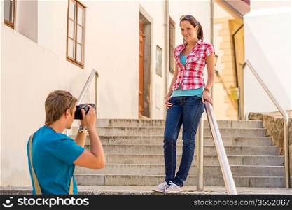 Young couple visit city take photos sightseeing tourist