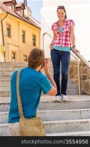 Young couple visit city take photos sightseeing tourist